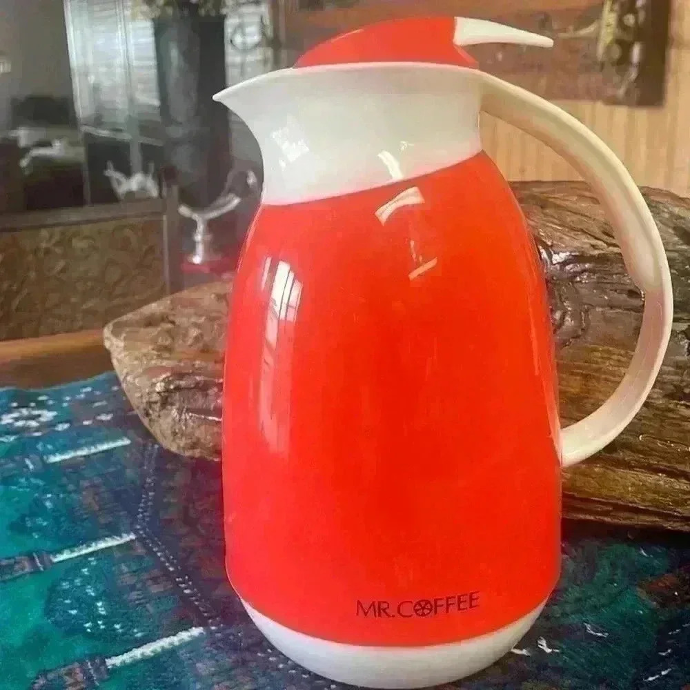 Mr. coffee vintage orange color container.  Holds 5 cups.